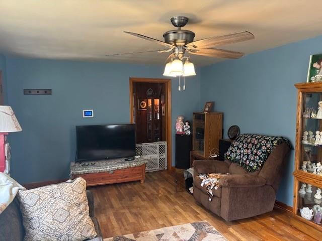 1119 Mound St, Atchison, KS 66002 - living room with ceiling fan and wood finished floors