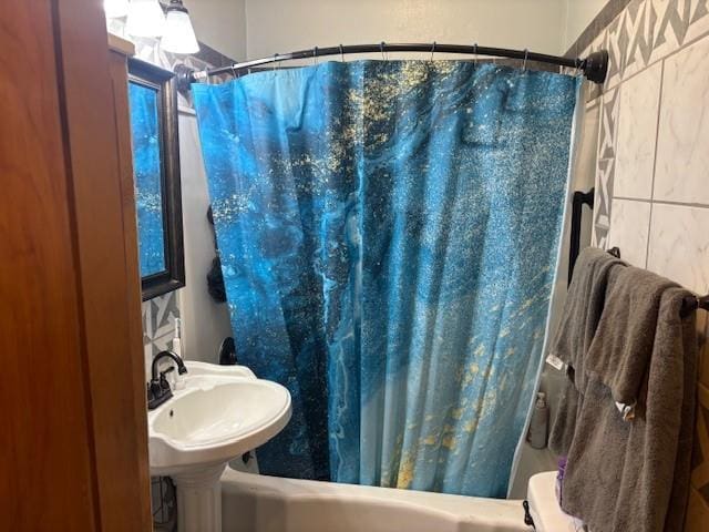 1119 Mound St, Atchison, KS 66002 - full bath with shower / bathtub combination with curtain and a sink