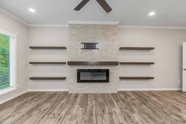 7515 Locust Dr, Kansas City, MO 64152 - unfurnished living room featuring a ceiling fan, wood finished floors, a large fireplace, ornamental molding, and baseboards