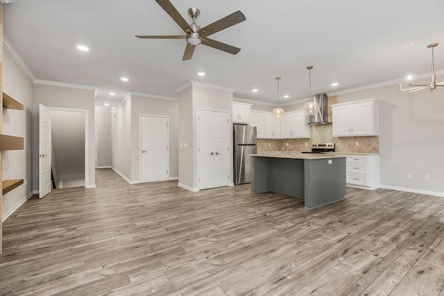 7515 Locust Dr, Kansas City, MO 64152 - kitchen featuring stainless steel appliances, wall chimney range hood, ceiling fan, light countertops, and recessed lighting