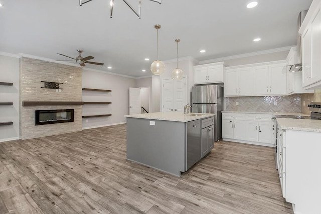 7515 Locust Dr, Kansas City, MO 64152 - kitchen with a ceiling fan, ornamental molding, light wood-style floors, white cabinetry, and recessed lighting