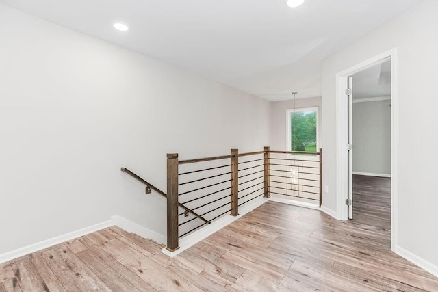 7515 Locust Dr, Kansas City, MO 64152 - staircase with wood finished floors, baseboards, and recessed lighting