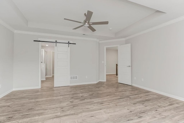 7515 Locust Dr, Kansas City, MO 64152 - spare room with a tray ceiling, ceiling fan, light wood-style floors, baseboards, and ornamental molding