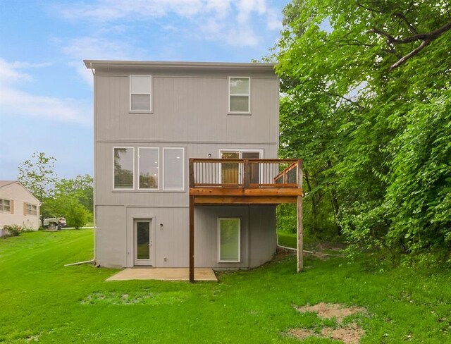 7515 Locust Dr, Kansas City, MO 64152 - back of house featuring a patio, a lawn, and a wooden deck