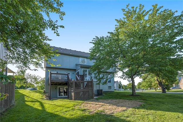 8901 W 128th St, Overland Park, KS 66213 - back of property featuring a wooden deck, a yard, and central air condition unit