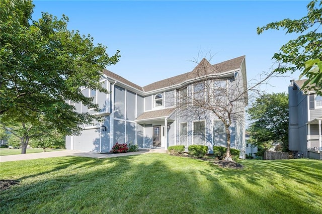 8901 W 128th St, Overland Park, KS 66213 - view of front of house with driveway, a front lawn, and a garage