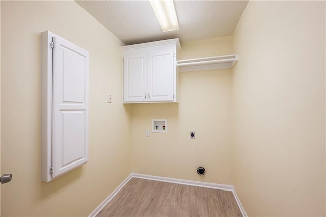 8901 W 128th St, Overland Park, KS 66213 - washroom featuring hookup for a washing machine, hookup for an electric dryer, wood finished floors, baseboards, and cabinet space