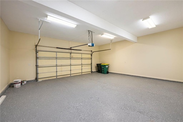 8901 W 128th St, Overland Park, KS 66213 - garage featuring a garage door opener and baseboards