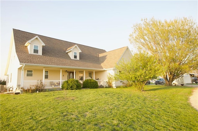 1744 21st Rd, Waverly, KS 66871 - cape cod house with a front yard, a porch, and a shingled roof