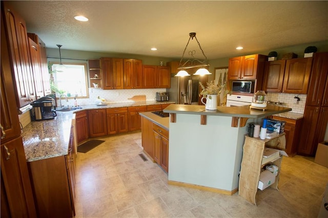 1744 21st Rd, Waverly, KS 66871 - kitchen with stainless steel refrigerator with ice dispenser, brown cabinetry, built in microwave, decorative backsplash, and recessed lighting