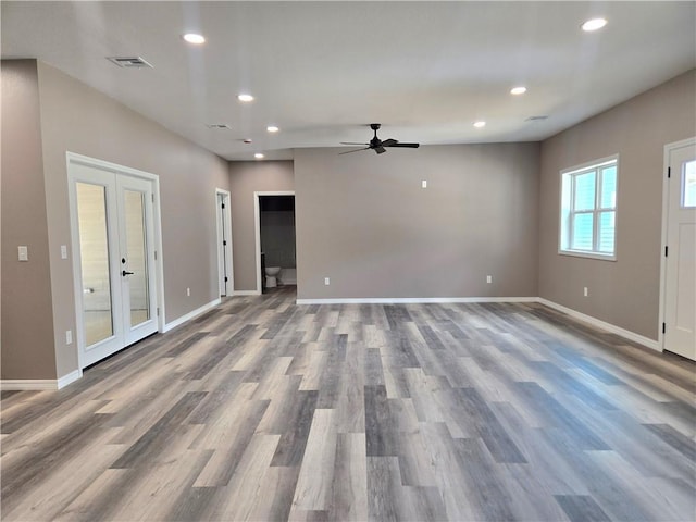 1101 Lakewood Dr, Pittsburg, KS 66762 - unfurnished living room featuring french doors, wood finished floors, a ceiling fan, recessed lighting, and baseboards