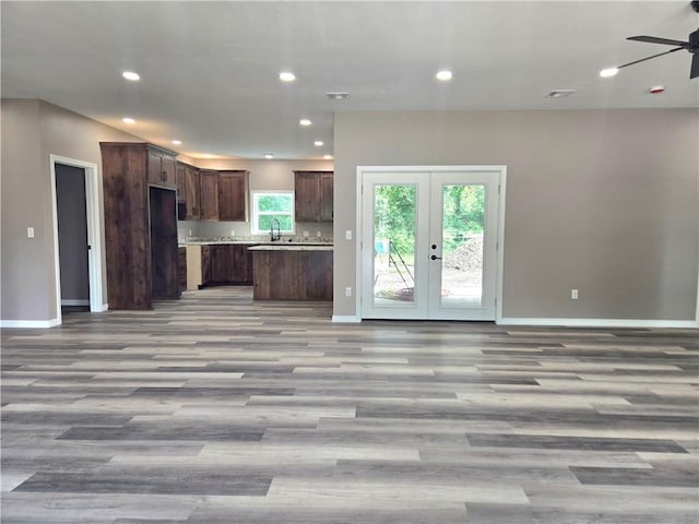 1101 Lakewood Dr, Pittsburg, KS 66762 - kitchen featuring open floor plan, a ceiling fan, light wood-style floors, baseboards, and recessed lighting