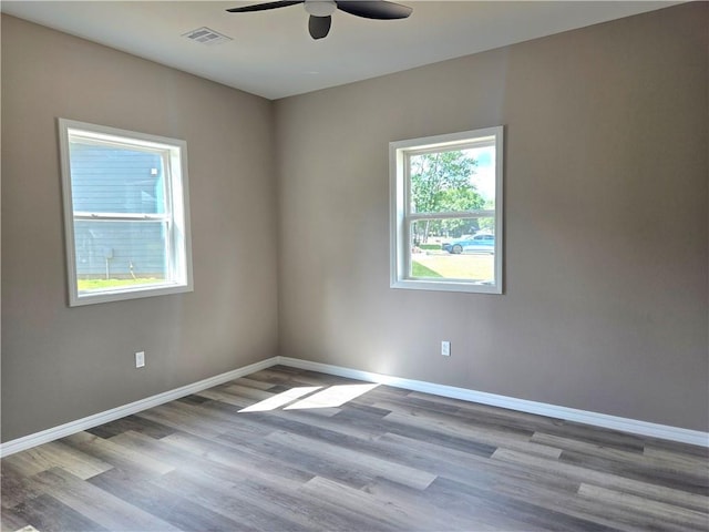 1101 Lakewood Dr, Pittsburg, KS 66762 - empty room featuring a ceiling fan, baseboards, and wood finished floors