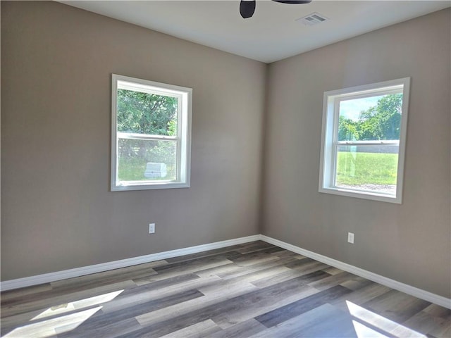 1101 Lakewood Dr, Pittsburg, KS 66762 - empty room featuring wood finished floors, baseboards, and ceiling fan