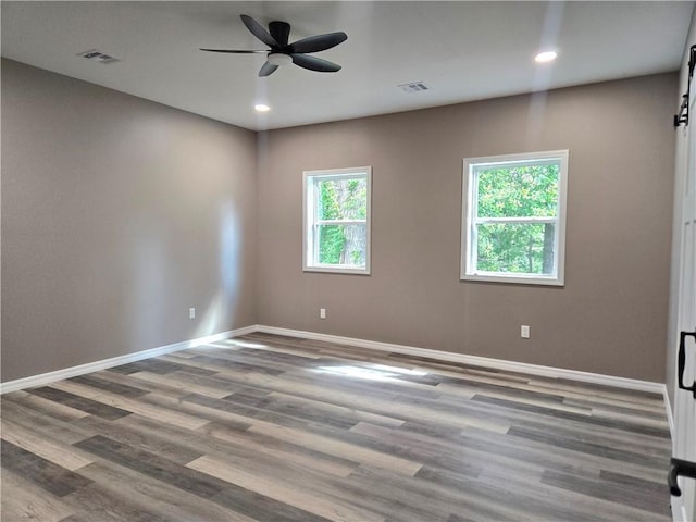 1101 Lakewood Dr, Pittsburg, KS 66762 - empty room with baseboards, ceiling fan, wood finished floors, and recessed lighting