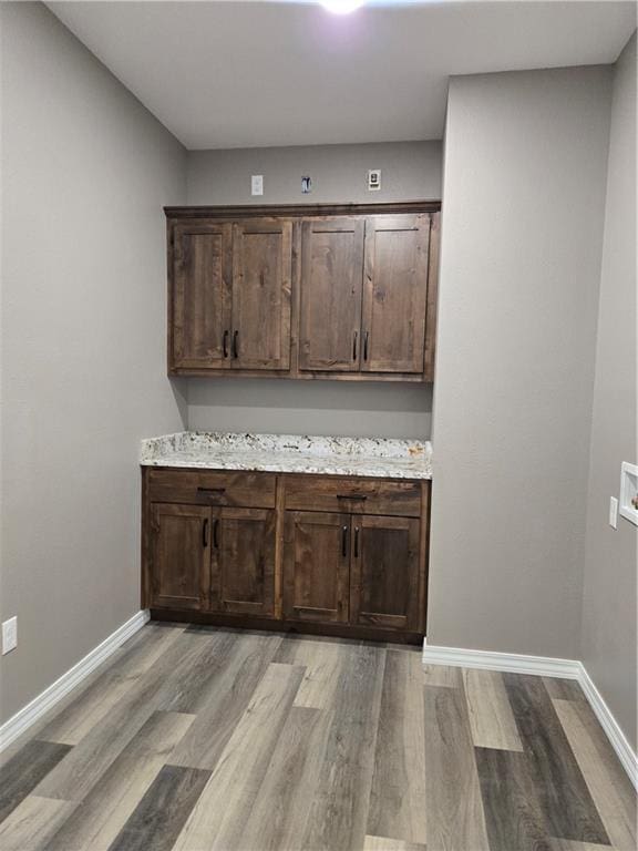 1101 Lakewood Dr, Pittsburg, KS 66762 - bar featuring light wood-type flooring and baseboards