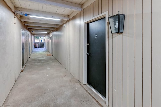 4157 Roanoke Rd Unit 2, Kansas City, MO 64111 - corridor featuring unfinished concrete floors and beam ceiling