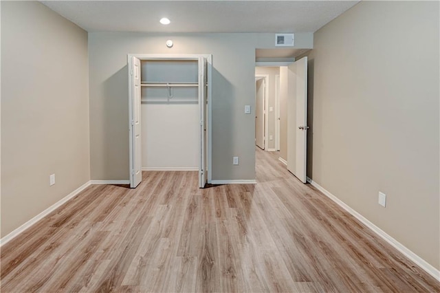4157 Roanoke Rd Unit 2, Kansas City, MO 64111 - unfurnished bedroom featuring light wood finished floors, a closet, baseboards, and recessed lighting