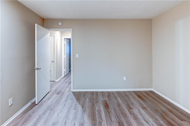 4157 Roanoke Rd Unit 2, Kansas City, MO 64111 - spare room featuring wood finished floors and baseboards