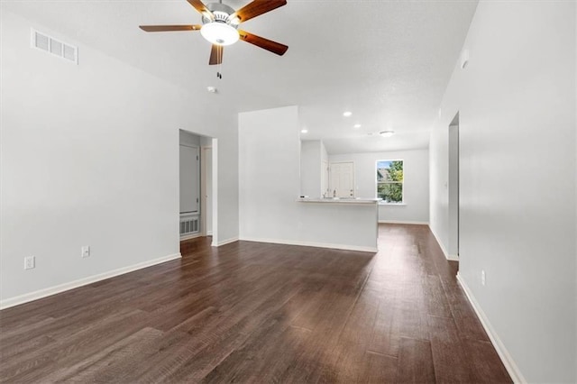 551 W Fountain St, Gardner, KS 66030 - unfurnished living room with a ceiling fan, dark wood-style flooring, and baseboards