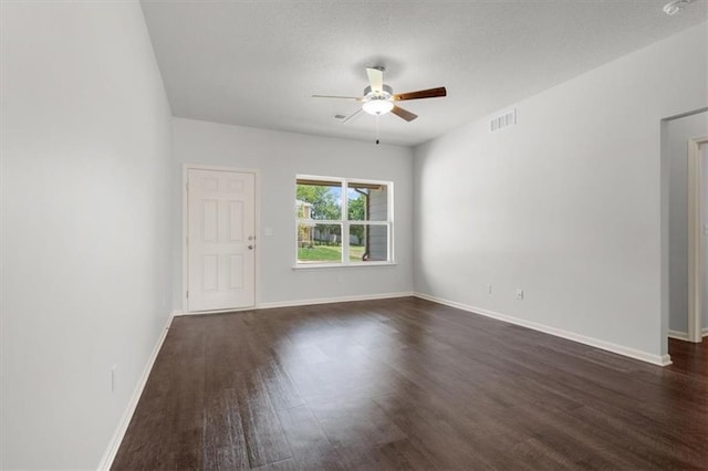 551 W Fountain St, Gardner, KS 66030 - unfurnished room with ceiling fan, dark wood-style flooring, and baseboards