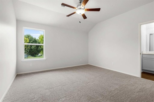 551 W Fountain St, Gardner, KS 66030 - carpeted spare room featuring vaulted ceiling, baseboards, and ceiling fan