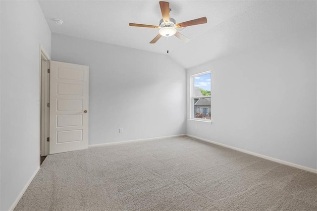 551 W Fountain St, Gardner, KS 66030 - spare room featuring carpet, ceiling fan, baseboards, and vaulted ceiling