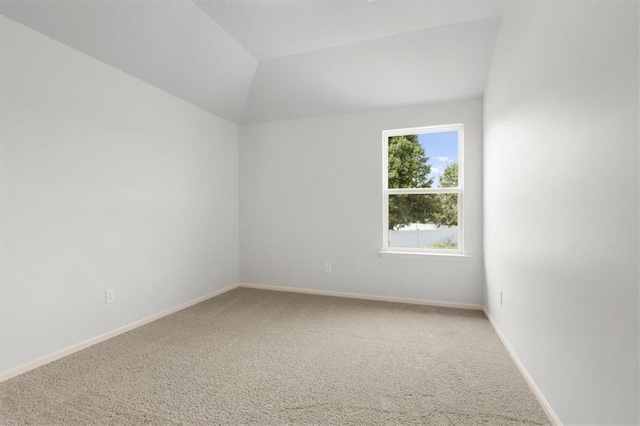 551 W Fountain St, Gardner, KS 66030 - carpeted spare room featuring baseboards and lofted ceiling