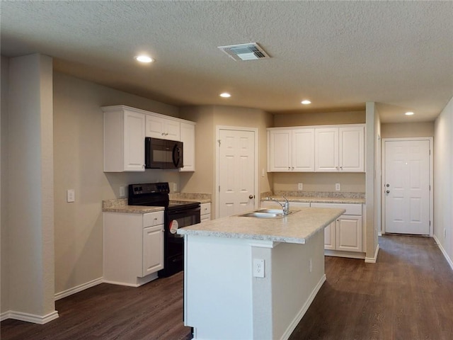 567 W Fountain St, Gardner, KS 66030 - kitchen featuring black appliances, a sink, dark wood-style floors, baseboards, and white cabinets