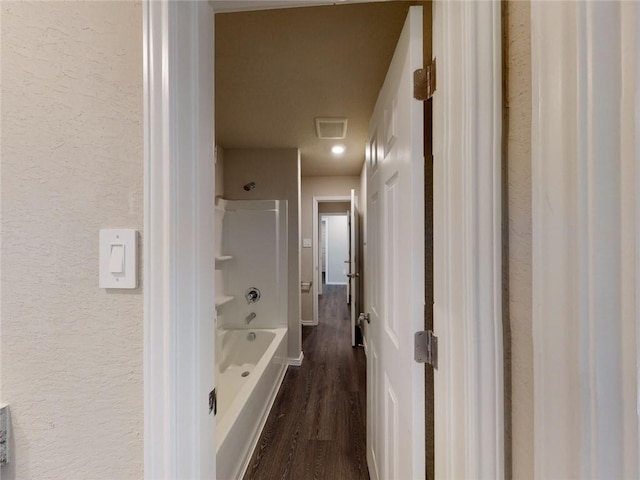 567 W Fountain St, Gardner, KS 66030 - full bathroom with a textured wall, wood finished floors, and  shower combination