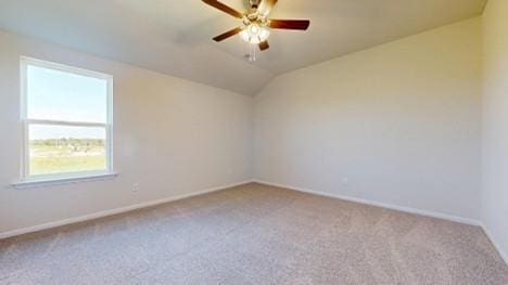 567 W Fountain St, Gardner, KS 66030 - carpeted spare room featuring a ceiling fan, baseboards, and lofted ceiling