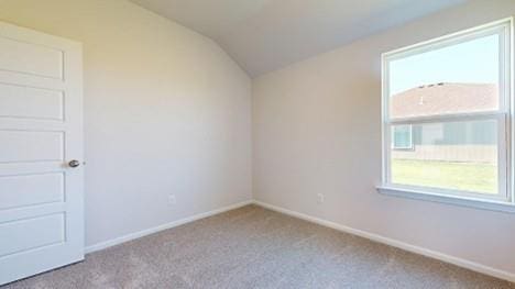 567 W Fountain St, Gardner, KS 66030 - unfurnished room featuring carpet, lofted ceiling, and baseboards