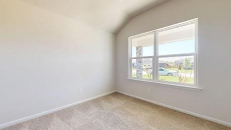 567 W Fountain St, Gardner, KS 66030 - empty room featuring lofted ceiling, light carpet, and baseboards