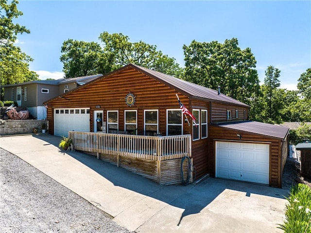 31425 Chance Ave, Warsaw, MO 65355 - view of front of property with driveway, an attached garage, and metal roof