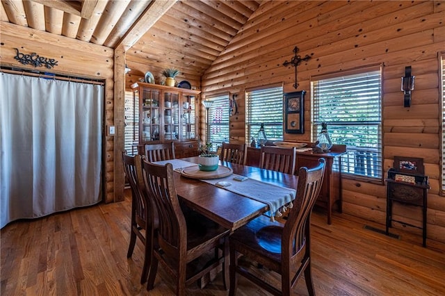 31425 Chance Ave, Warsaw, MO 65355 - dining space with hardwood / wood-style floors, vaulted ceiling, rustic walls, and wood ceiling