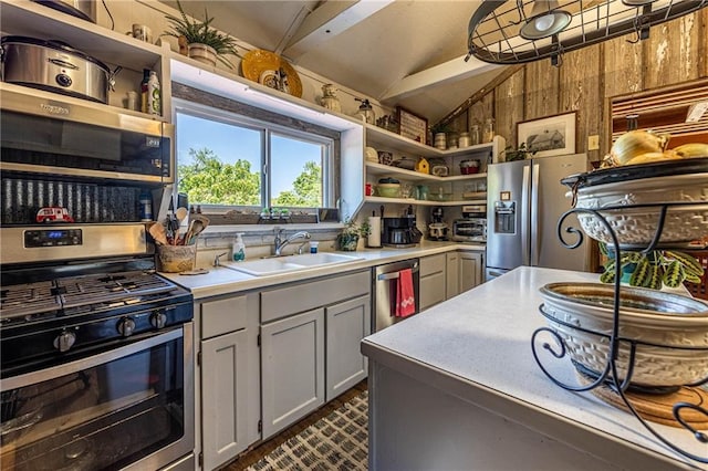 31425 Chance Ave, Warsaw, MO 65355 - kitchen with appliances with stainless steel finishes, a sink, lofted ceiling, open shelves, and light countertops