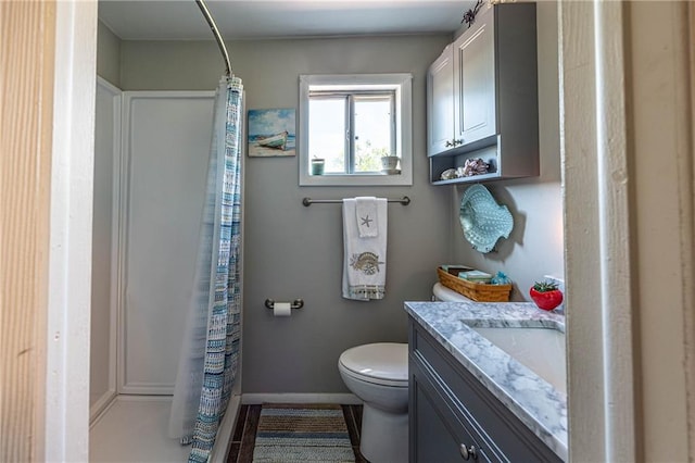 31425 Chance Ave, Warsaw, MO 65355 - bathroom with toilet, vanity, curtained shower, and baseboards