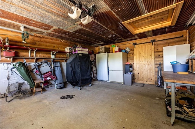 31425 Chance Ave, Warsaw, MO 65355 - garage featuring freestanding refrigerator and a garage door opener