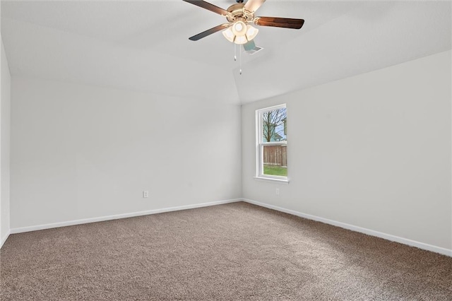 597 W Fountain St, Gardner, KS 66030 - carpeted spare room with vaulted ceiling, baseboards, and ceiling fan