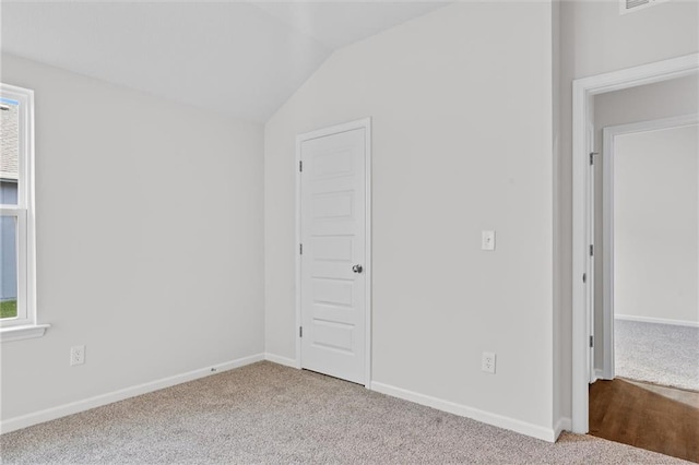 597 W Fountain St, Gardner, KS 66030 - unfurnished room with carpet, vaulted ceiling, and baseboards