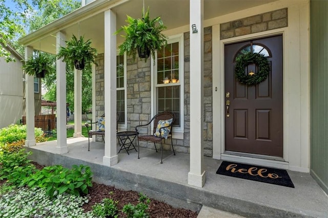 14155 W 147th Ter, Olathe, KS 66062 - property entrance featuring covered porch and stone siding