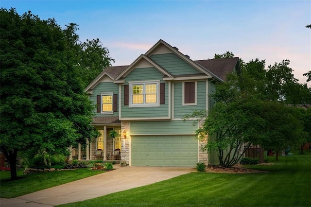 14155 W 147th Ter, Olathe, KS 66062 - view of front facade with concrete driveway, a garage, a yard, and stone siding
