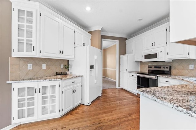 14155 W 147th Ter, Olathe, KS 66062 - kitchen featuring white appliances, white cabinets, light wood-type flooring, glass insert cabinets, and ornamental molding