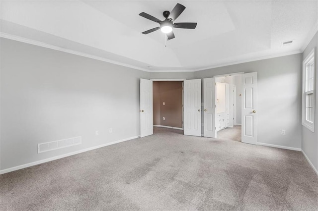 14155 W 147th Ter, Olathe, KS 66062 - unfurnished bedroom with carpet floors, crown molding, baseboards, a tray ceiling, and a ceiling fan