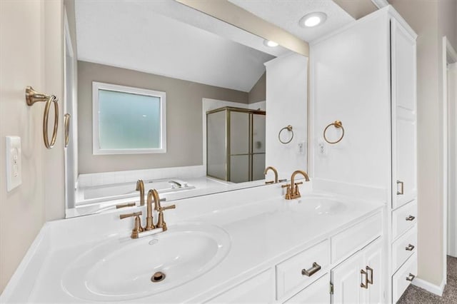 14155 W 147th Ter, Olathe, KS 66062 - bathroom with a shower stall, a garden tub, double vanity, and lofted ceiling