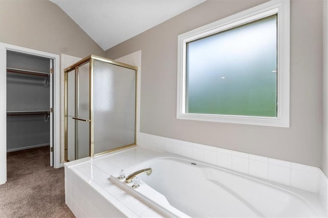 14155 W 147th Ter, Olathe, KS 66062 - full bathroom featuring a stall shower, a garden tub, a walk in closet, and vaulted ceiling