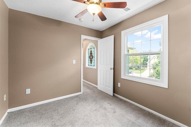 14155 W 147th Ter, Olathe, KS 66062 - empty room with light carpet, baseboards, and a ceiling fan
