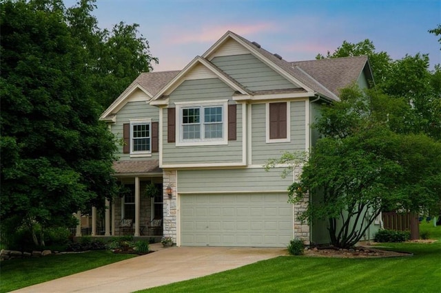 14155 W 147th Ter, Olathe, KS 66062 - craftsman inspired home featuring driveway, stone siding, a garage, a yard, and a shingled roof