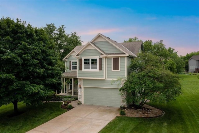 14155 W 147th Ter, Olathe, KS 66062 - craftsman inspired home with concrete driveway, stone siding, a front yard, and a garage