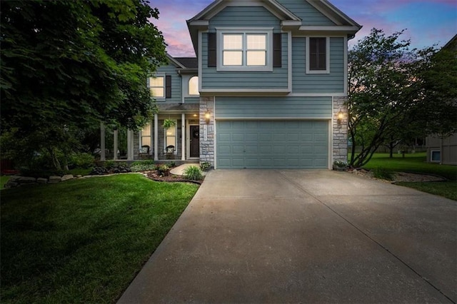 14155 W 147th Ter, Olathe, KS 66062 - view of front of home featuring stone siding, a yard, driveway, and a garage
